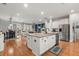 Open concept kitchen and living room featuring an island with granite countertops and stainless steel appliances at 1992 Kings Gate Ln, Mount Pleasant, SC 29466
