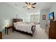Bright, spacious main bedroom with a ceiling fan and comfortable seating area and bedroom suite at 1992 Kings Gate Ln, Mount Pleasant, SC 29466