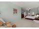Inviting main bedroom featuring a sitting area, TV, ceiling fan, and soothing neutral colors at 1992 Kings Gate Ln, Mount Pleasant, SC 29466