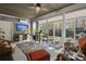 Charming sunroom features tile floors, wood ceiling, and a sliding glass door leading to the backyard at 1992 Kings Gate Ln, Mount Pleasant, SC 29466