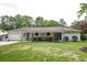 Open backyard with a covered patio, ideal for enjoying outdoor activities and relaxation at 203 Red Fox Run, Summerville, SC 29485