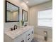 Bright bathroom features double sinks, modern fixtures, and luxury finishes at 203 Red Fox Run, Summerville, SC 29485