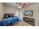 Comfortable bedroom features a ceiling fan and a modern dresser with mounted TV at 203 Red Fox Run, Summerville, SC 29485