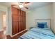 Bright bedroom with a built-in wardrobe and a bed with a wooden headboard at 203 Red Fox Run, Summerville, SC 29485