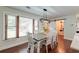 Light-filled dining area featuring wood floors, modern lighting, and neutral decor at 203 Red Fox Run, Summerville, SC 29485