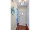 Inviting entryway features wood floors, an anchor decoration, and a bright white front door at 203 Red Fox Run, Summerville, SC 29485