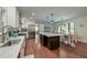 Open concept kitchen featuring white cabinets, a kitchen island, and stainless appliances at 203 Red Fox Run, Summerville, SC 29485