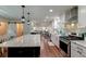 Modern kitchen with marble countertops, stainless steel appliances, and an open design at 203 Red Fox Run, Summerville, SC 29485