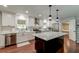 Modern kitchen featuring white cabinets, stainless steel appliances, and a marble island at 203 Red Fox Run, Summerville, SC 29485