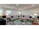 Comfortable living room featuring a large sectional sofa, and a colorful rug at 203 Red Fox Run, Summerville, SC 29485
