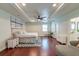 Spacious main bedroom features hardwood floors, a ceiling fan, and ensuite bathroom at 203 Red Fox Run, Summerville, SC 29485