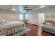 Bright main bedroom features coffered ceilings, a ceiling fan, and hardwood floors at 203 Red Fox Run, Summerville, SC 29485