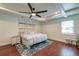 Bright main bedroom features hardwood floors, neutral paint, and a ceiling fan at 203 Red Fox Run, Summerville, SC 29485