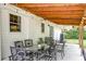 Outdoor patio area featuring stylish furniture, overhead lighting, and a cozy atmosphere at 203 Red Fox Run, Summerville, SC 29485