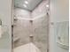 Modern tiled shower with a glass door, rainfall shower head, and built-in shelves at 203 Red Fox Run, Summerville, SC 29485