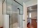 Modern shower with glass enclosure, subway tile, and rainfall shower head at 203 Red Fox Run, Summerville, SC 29485