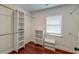 Walk-in closet with custom storage, shelving, and hardwood floors at 203 Red Fox Run, Summerville, SC 29485