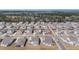 An aerial shot shows a well-planned community with houses in a neighborhood with sidewalks and mature trees at 2064 Parish House Cir, Johns Island, SC 29455