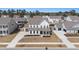 Spacious suburban home with a well-manicured lawn, surrounded by lush greenery and neighboring houses at 2064 Parish House Cir, Johns Island, SC 29455