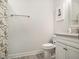 Bright bathroom featuring a toilet, shower with curtain, and modern vanity at 2064 Parish House Cir, Johns Island, SC 29455