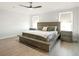 Bedroom with a modern bed, wood-look floors, ceiling fan and plenty of natural light at 2064 Parish House Cir, Johns Island, SC 29455