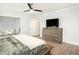 Bedroom with stylish furniture, wood-look floors, ceiling fan and plenty of natural light at 2064 Parish House Cir, Johns Island, SC 29455