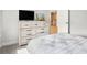 Cozy bedroom with a white dresser, television, and soft gray walls at 2064 Parish House Cir, Johns Island, SC 29455