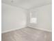 Neutral carpeted bedroom bathed in natural light from one large window at 2064 Parish House Cir, Johns Island, SC 29455