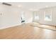 Spacious bedroom with wood floors, plenty of natural light, and a view into another room at 2064 Parish House Cir, Johns Island, SC 29455