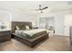 Bedroom with stylish furniture, wood-look floors, ceiling fan and plenty of natural light at 2064 Parish House Cir, Johns Island, SC 29455