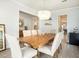 Light and airy dining room with a wood table and unique chandelier at 2064 Parish House Cir, Johns Island, SC 29455