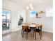 Bright dining room with a round table, wood floors, and windows with lots of natural light at 2064 Parish House Cir, Johns Island, SC 29455