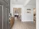 Inviting entryway with hardwood floors, a stylish console table, and an open view into the living spaces at 2064 Parish House Cir, Johns Island, SC 29455