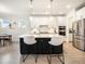 Modern kitchen with stainless steel appliances, island with counter seating, and white cabinets at 2064 Parish House Cir, Johns Island, SC 29455