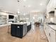 Bright and airy kitchen with a farm sink, stainless steel appliances, and large island at 2064 Parish House Cir, Johns Island, SC 29455