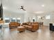 Bright living room with comfortable seating, recessed lighting, and seamless flow into the dining area at 2064 Parish House Cir, Johns Island, SC 29455