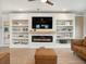 Cozy living room with a modern fireplace, built-in shelving, and stylish decor for a relaxing atmosphere at 2064 Parish House Cir, Johns Island, SC 29455