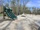 Neighborhood playground area with green slides, and wood chip ground covering at 2064 Parish House Cir, Johns Island, SC 29455