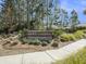 Community entrance sign amidst lush greenery, reading 'Grace Landing' at 2064 Parish House Cir, Johns Island, SC 29455