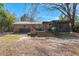 The backyard features a brick house with a deck, and a patio at 2138 Clayton St, Charleston, SC 29414