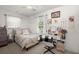 Bright bedroom with carpet, a window, white curtains, a fan and neutral-colored walls and decor at 2138 Clayton St, Charleston, SC 29414