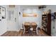 This dining area features a door to the outside, beach artwork, and a decorative quilt table runner at 2138 Clayton St, Charleston, SC 29414