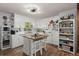 Bright, updated kitchen featuring white cabinetry, stainless steel appliances, and a central island at 2138 Clayton St, Charleston, SC 29414