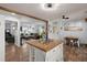 Open concept living area features a kitchen island, hardwood floors, and lots of natural light at 2138 Clayton St, Charleston, SC 29414