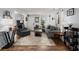 Bright living room featuring a comfortable gray sectional, hardwood floors, and stylish decor at 2138 Clayton St, Charleston, SC 29414