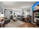 Comfortable living room featuring hardwood floors, a cozy gray sectional, and lots of natural light at 2138 Clayton St, Charleston, SC 29414