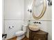 Charming powder room featuring a unique vessel sink and elegant finishes, offers a stylish space for guests at 2206 Weepoolow Trl, Charleston, SC 29407
