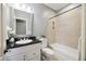 Bathroom featuring a vanity with a black countertop, a toilet, and a tiled bathtub with shower at 2206 Weepoolow Trl, Charleston, SC 29407