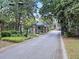 Gated community entrance with lush landscaping and well-maintained security ensuring privacy and exclusivity at 2206 Weepoolow Trl, Charleston, SC 29407