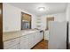 Traditional kitchen features white cabinets, an under-mount sink, and updated appliances at 2206 Weepoolow Trl, Charleston, SC 29407